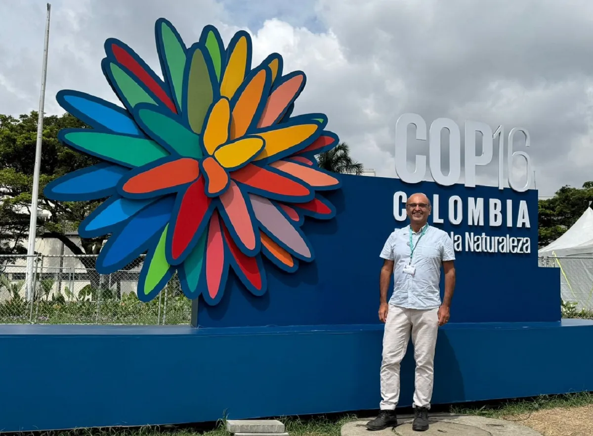 Prof Yadvinder Malhi in front of the COP16 sign