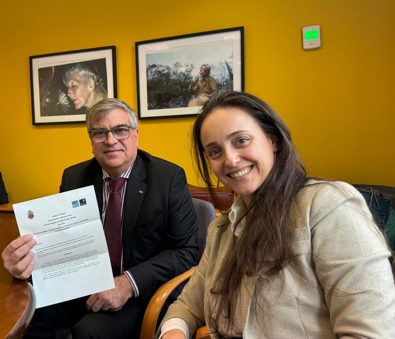 Prof Carlos Carlotti, the Vice-Chancellor of USP holding letter of intention next to Dr Manoela Machado