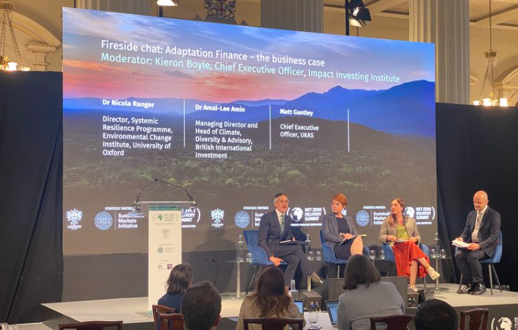 Panel in front of audience at the Summit