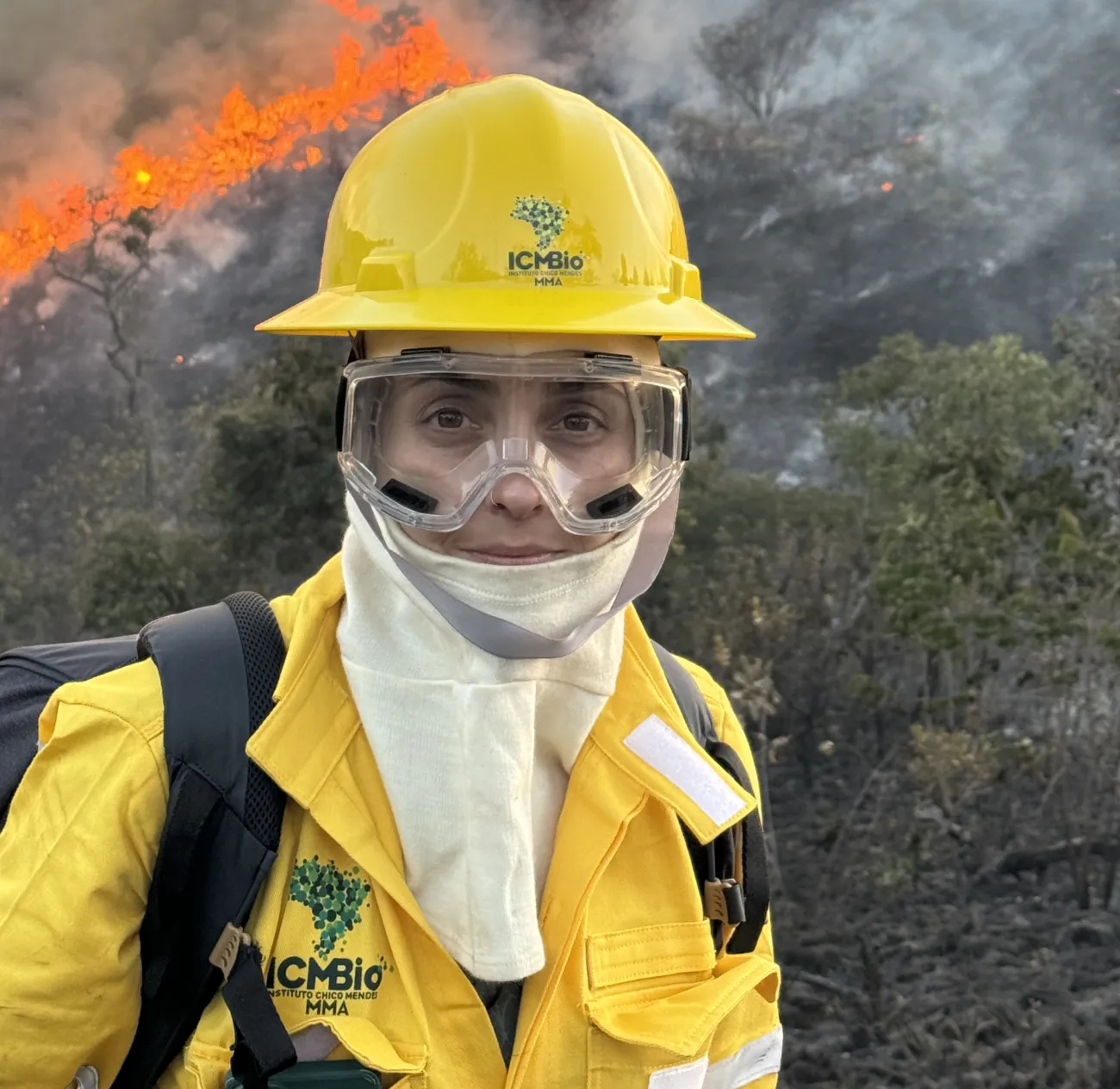 Dr Manoela Machado in fire protection clothing in burning forest