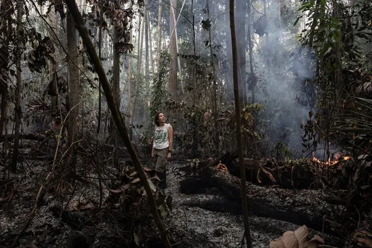 Dr Erika Berenguer stood within the burning Amazon