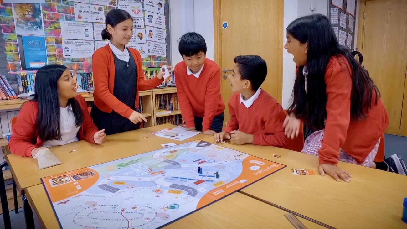 Children playing a bean game they devised