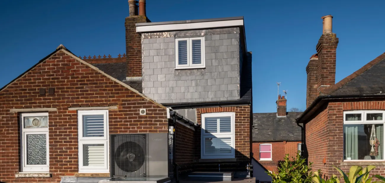 The outside of a home with a heat pump installed