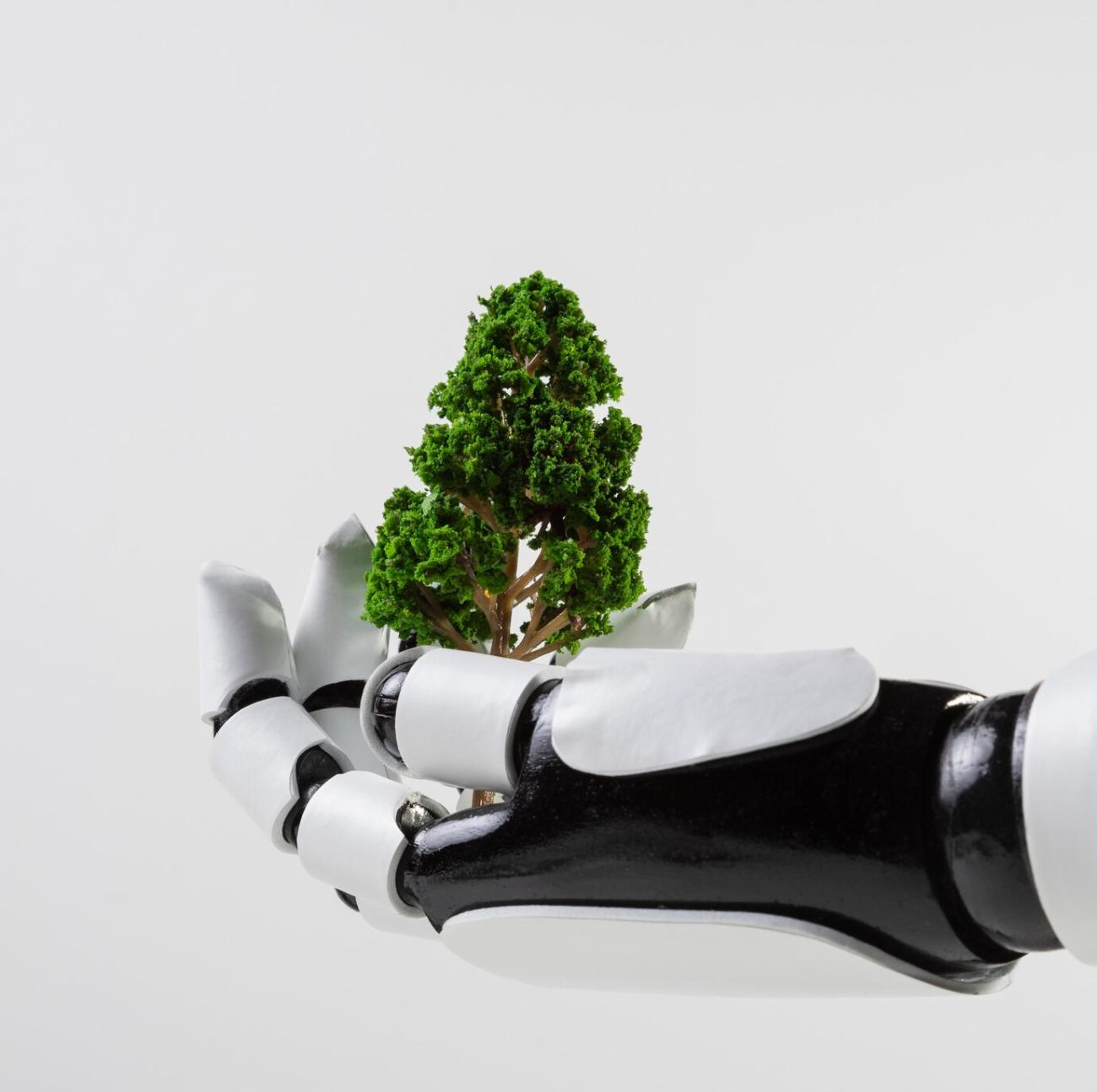 Robotic hand holding a tree