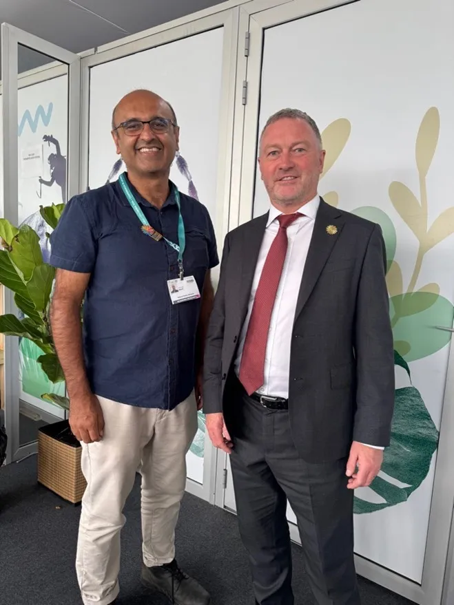 Prof Malhi stood next UK Secretary of State Steve Reed