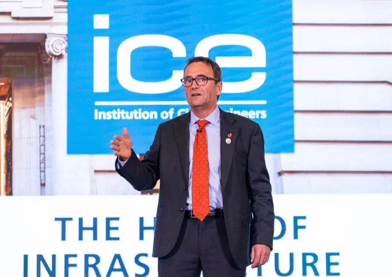 Prof Jim Hall in front of the ICE logo at his Presidential Address