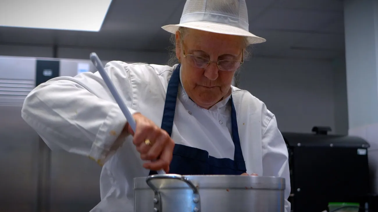 School chef cooking in school kitchen