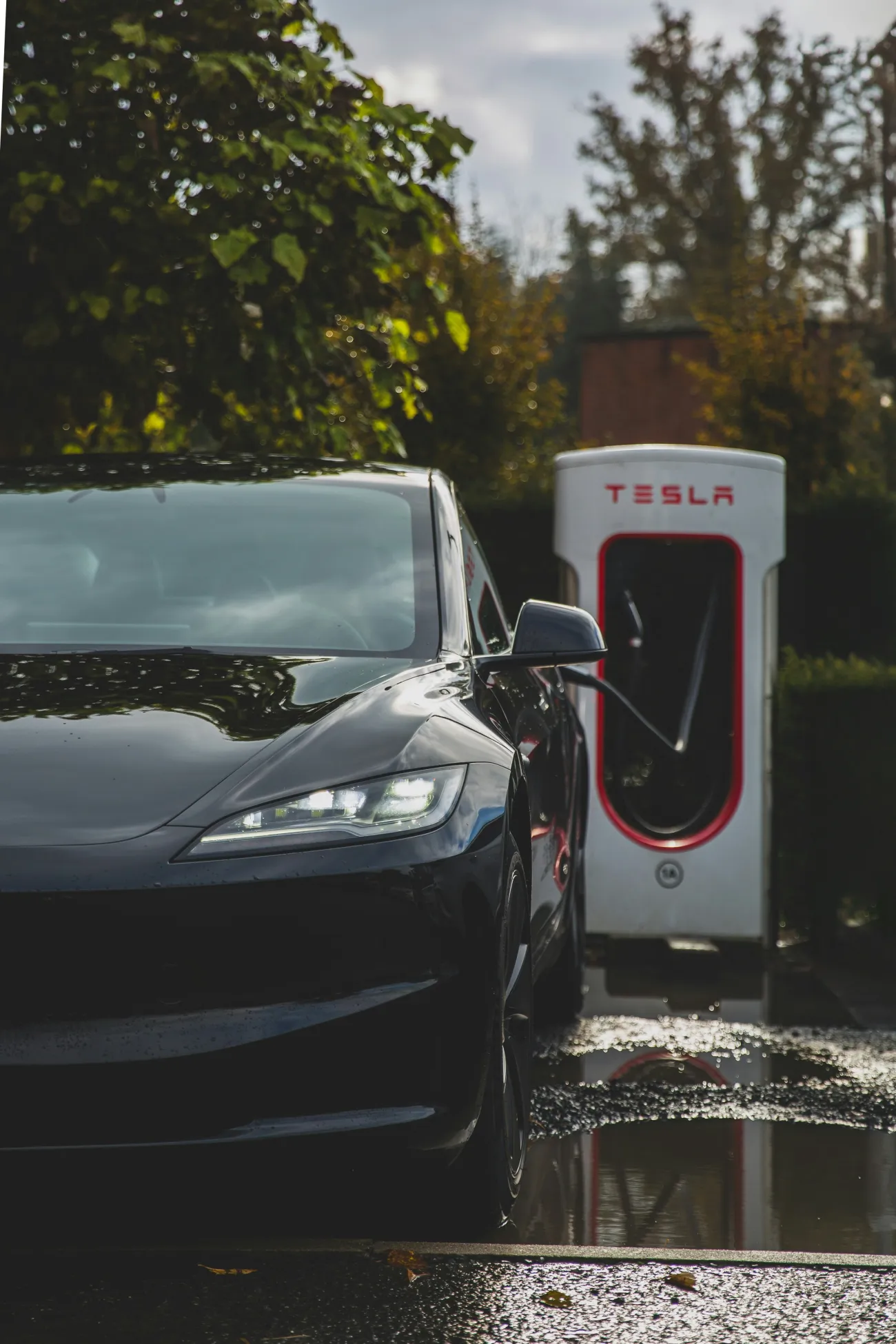 Tesla Model 3 Highland charging at a Supercharger