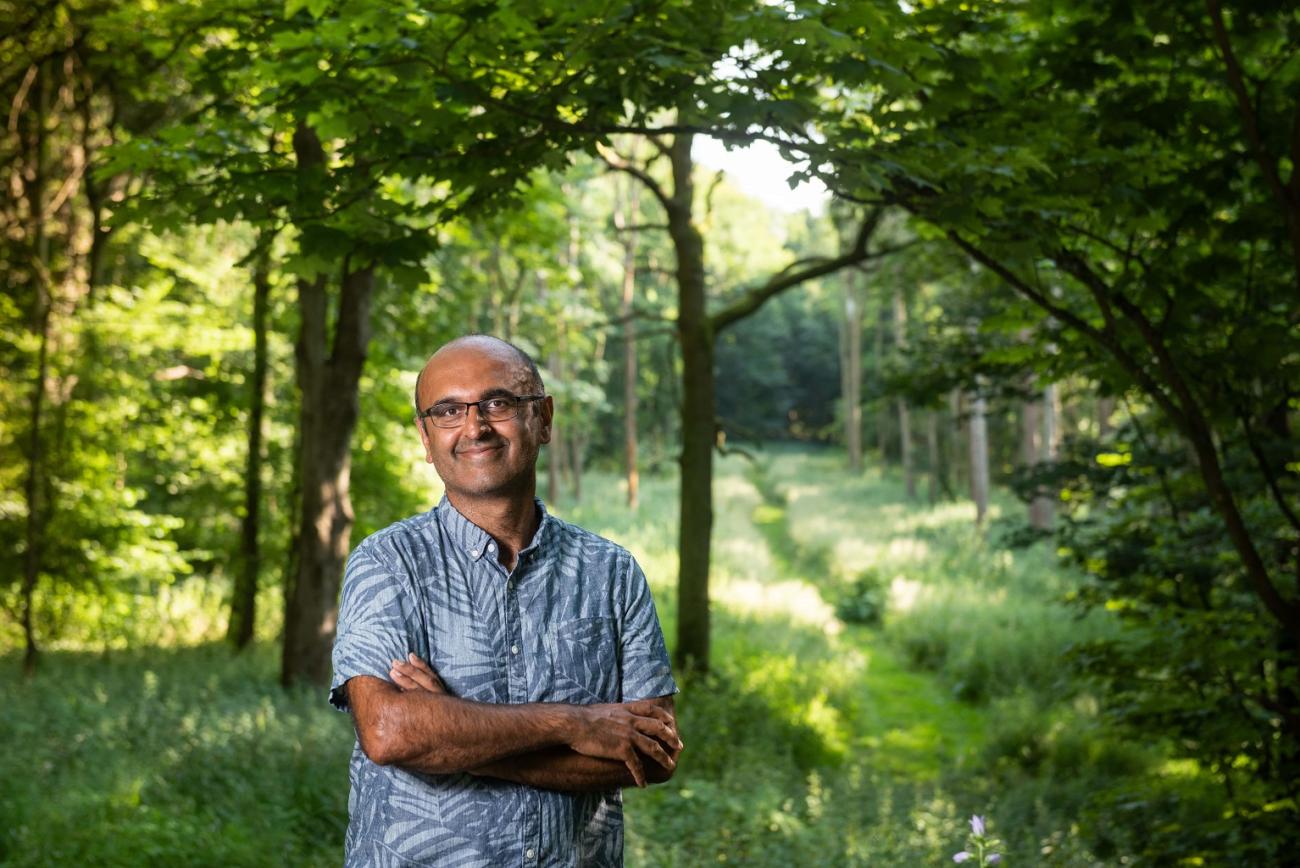 Prof Yadvinder Malhi standing in Wytham Woods