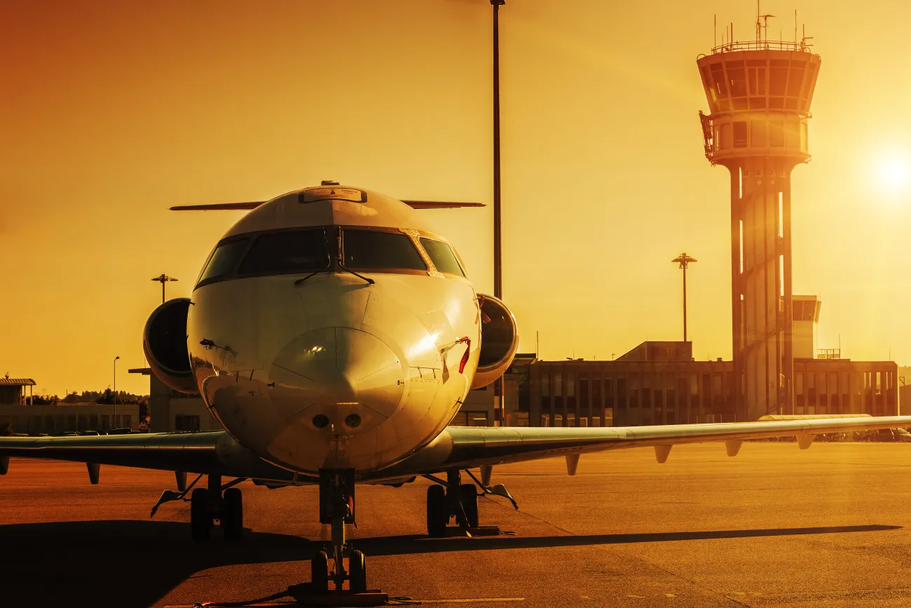 Aeroplane on runway at sunset