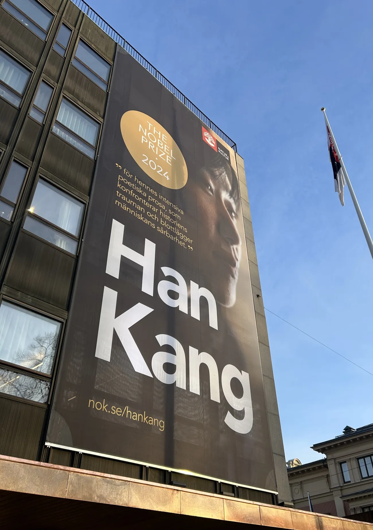 A banner of Han Kang, Nobel Laureate for Literature 2024 on a building