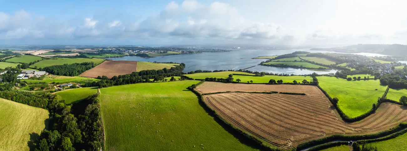 Farms and Fields over River Tamar Estuary from a drone, Cornwall, England