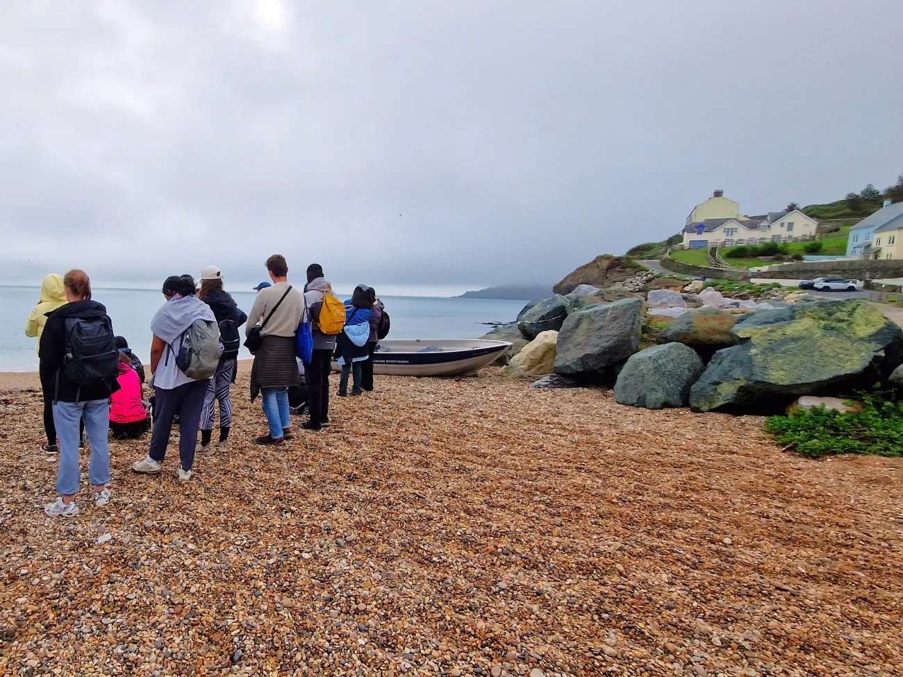 MSc students observe the coastal erosion and flood risks at Torcross, south Devon. 