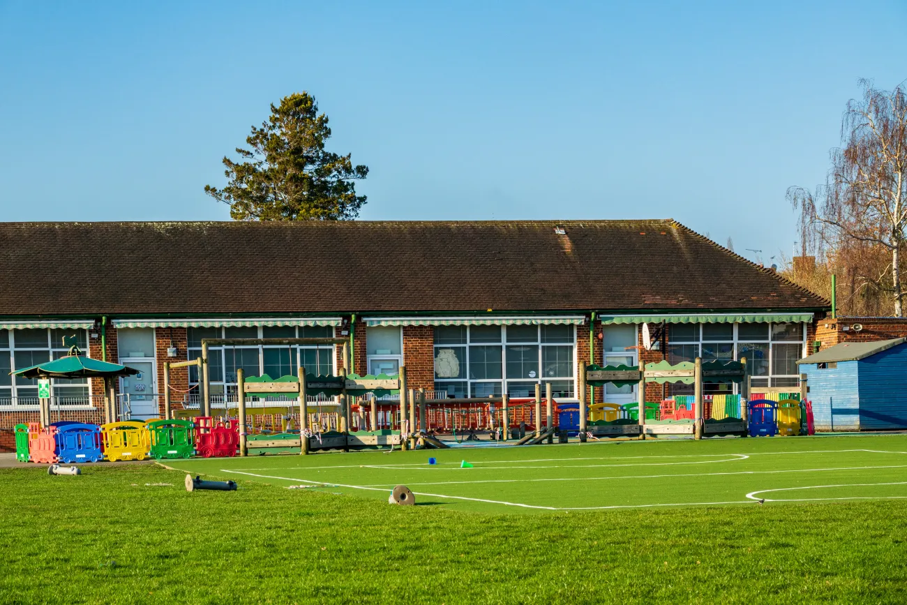 British Junior school playground & infant school playing fields on a sunny day