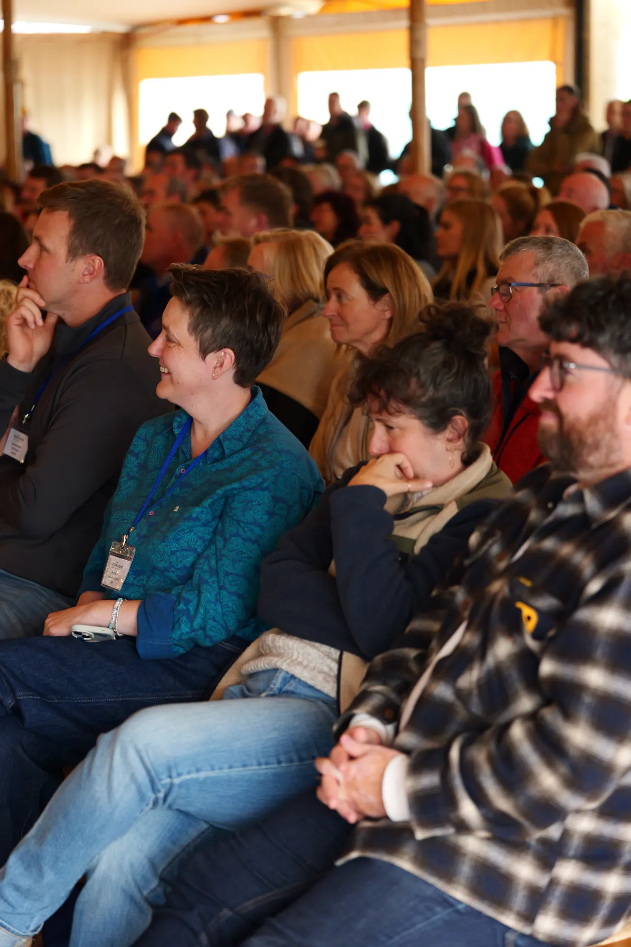 Audience members listening to a talk