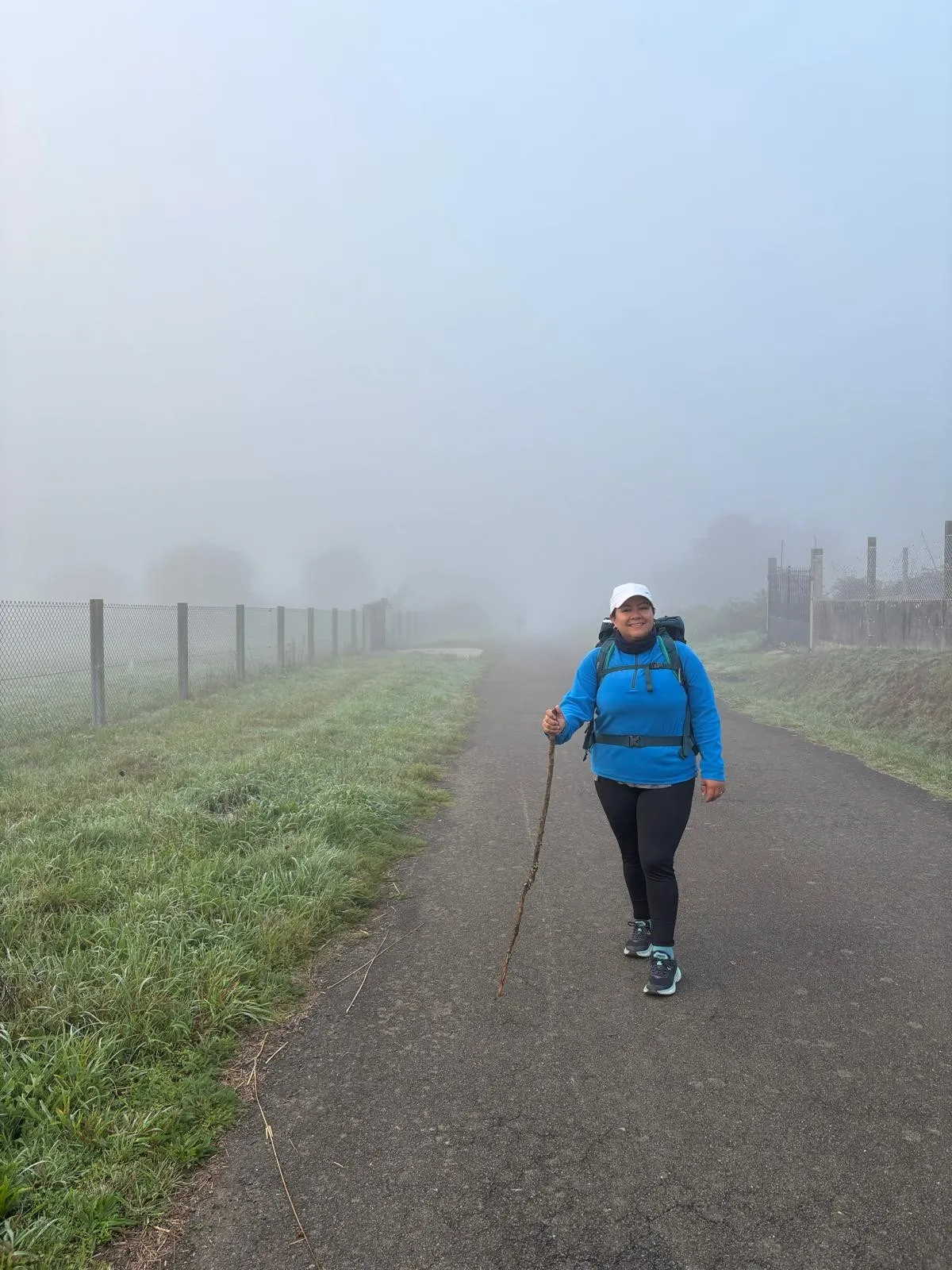 Angela Soasti Pozo walking with a stick along the route