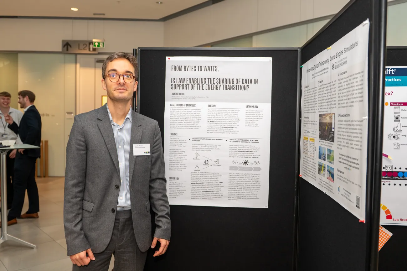 Poster competition entrant Antoine next to his poster
