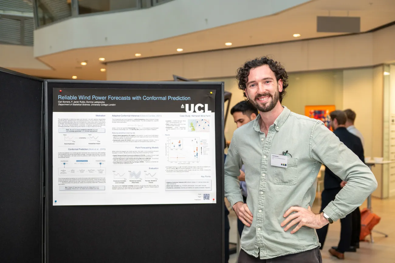 Poster competition entrant Carl next to his poster