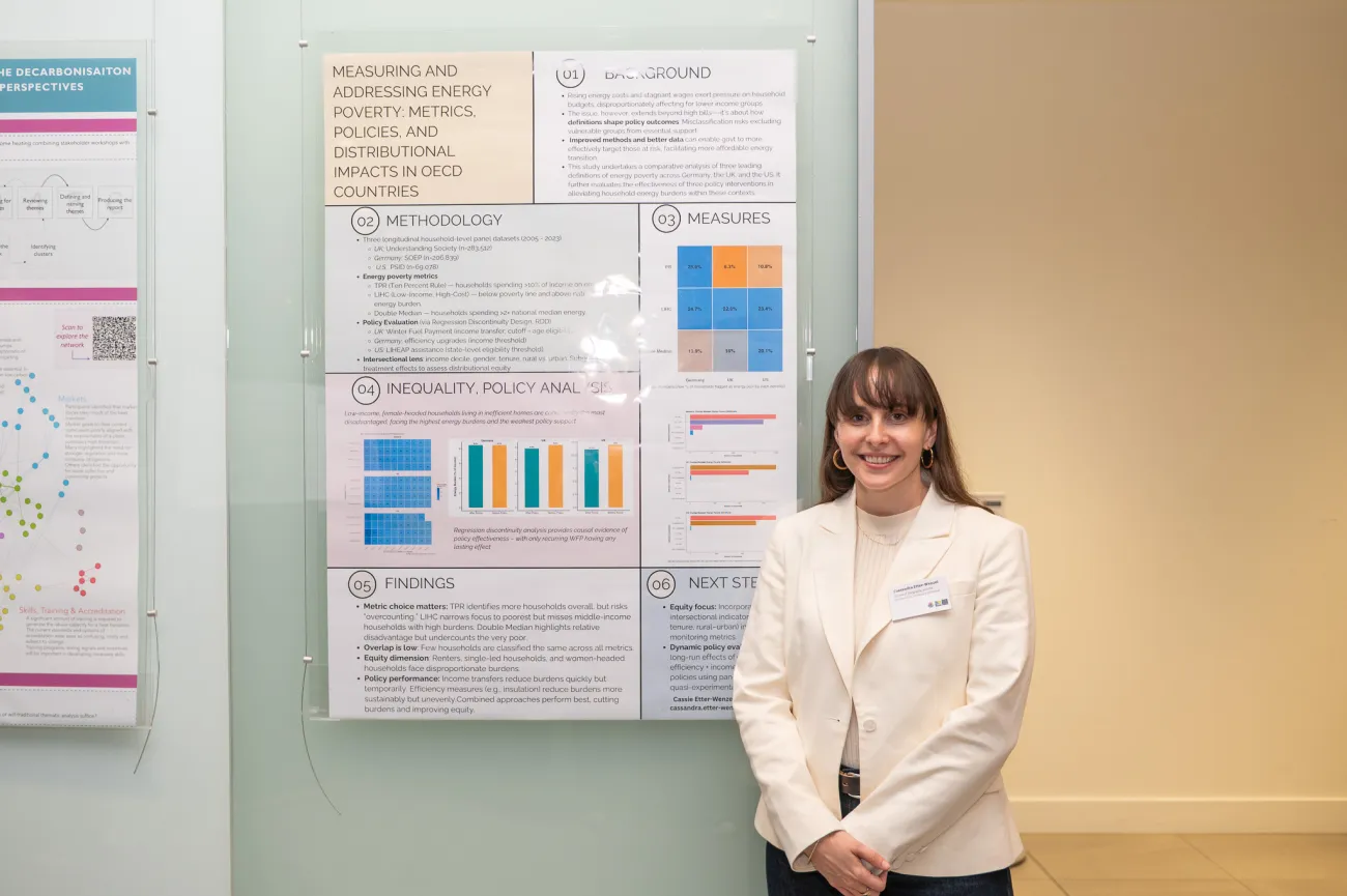 Poster competition entrant Cassie next to her poster