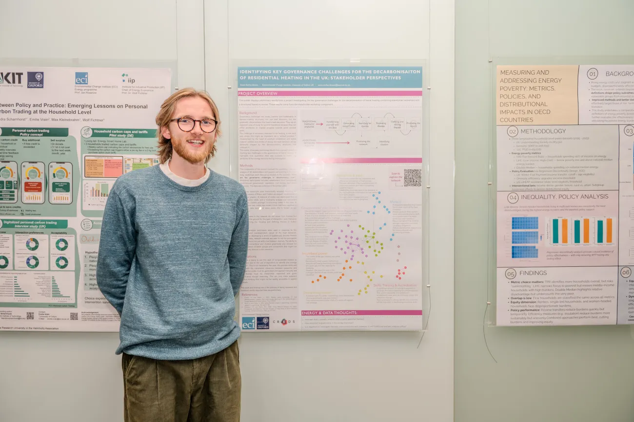 Poster competition entrant Ewer next to his poster