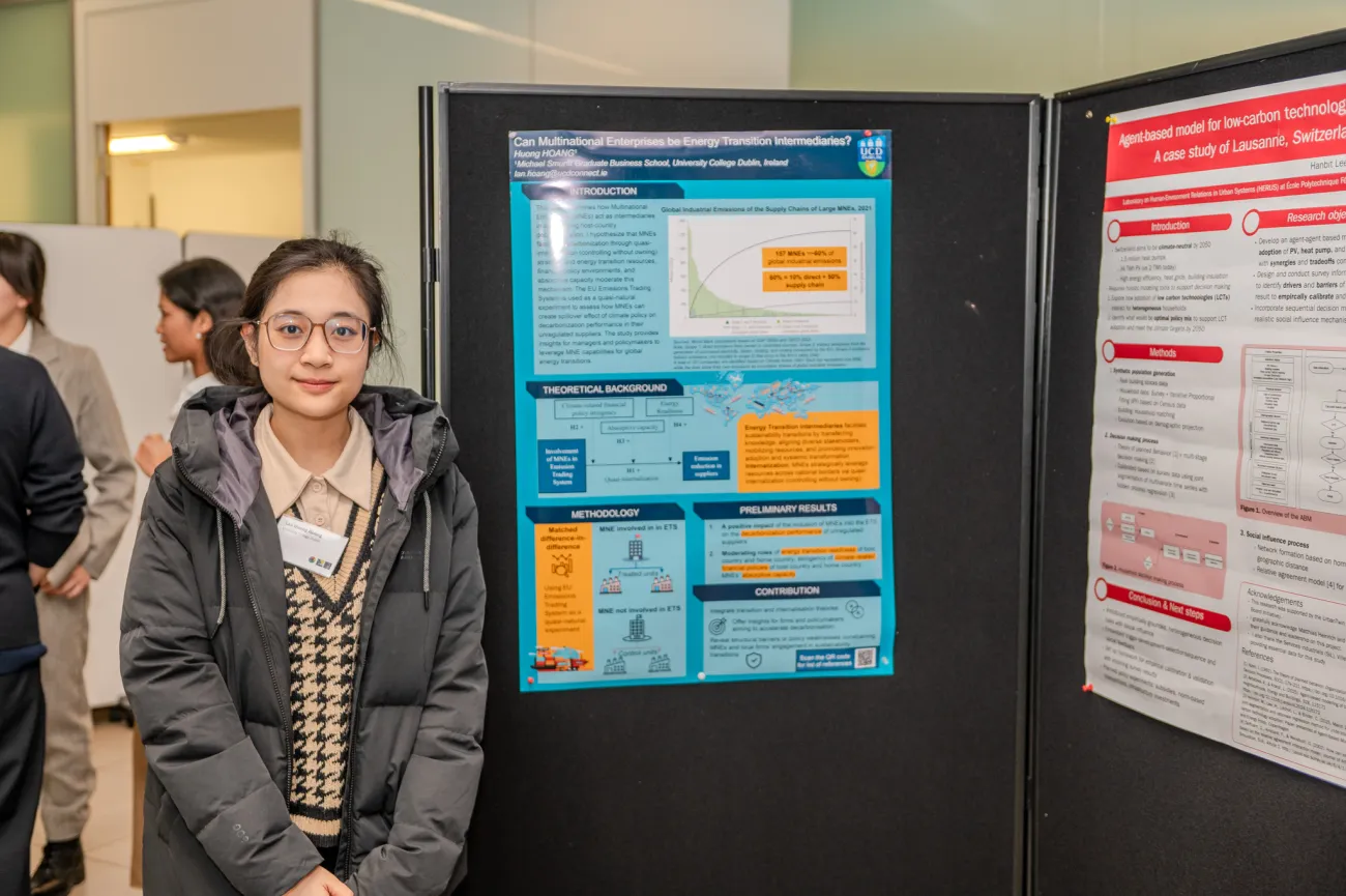 Poster competition entrant Huong next to her poster