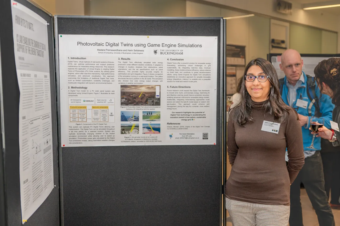 Poster competition entrant Madara next to her poster