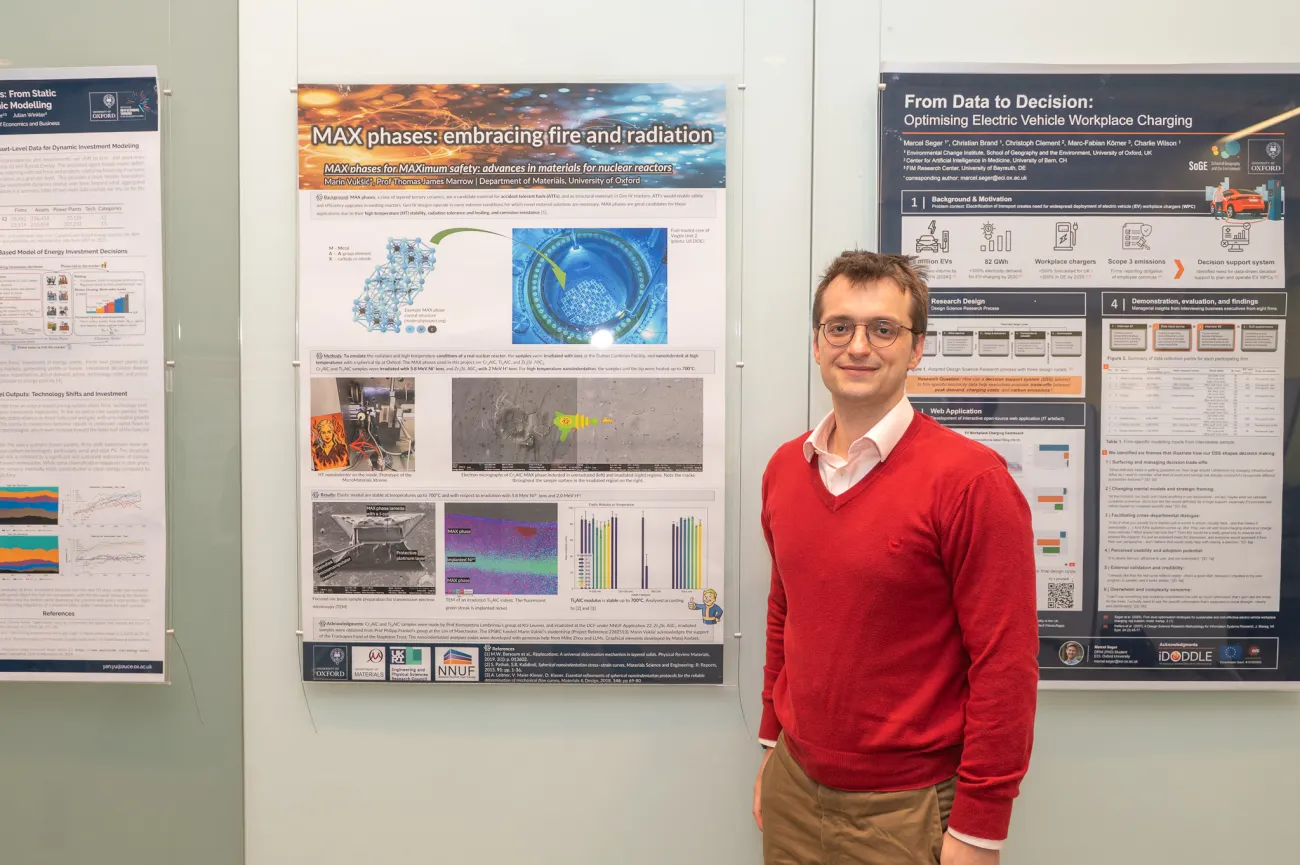 Poster competition entrant Marin next to his poster