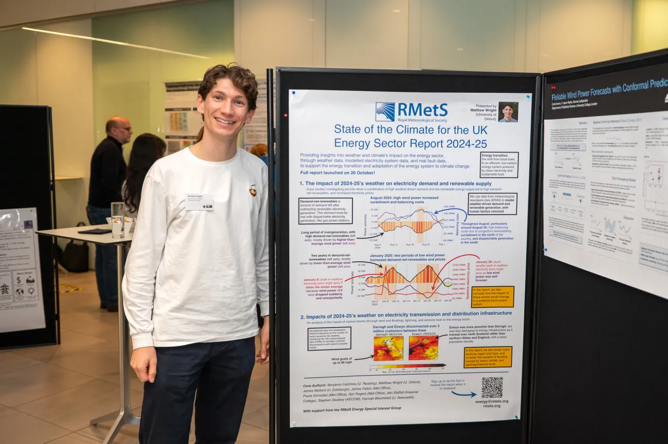 Poster competition entrant Mathew next to his poster