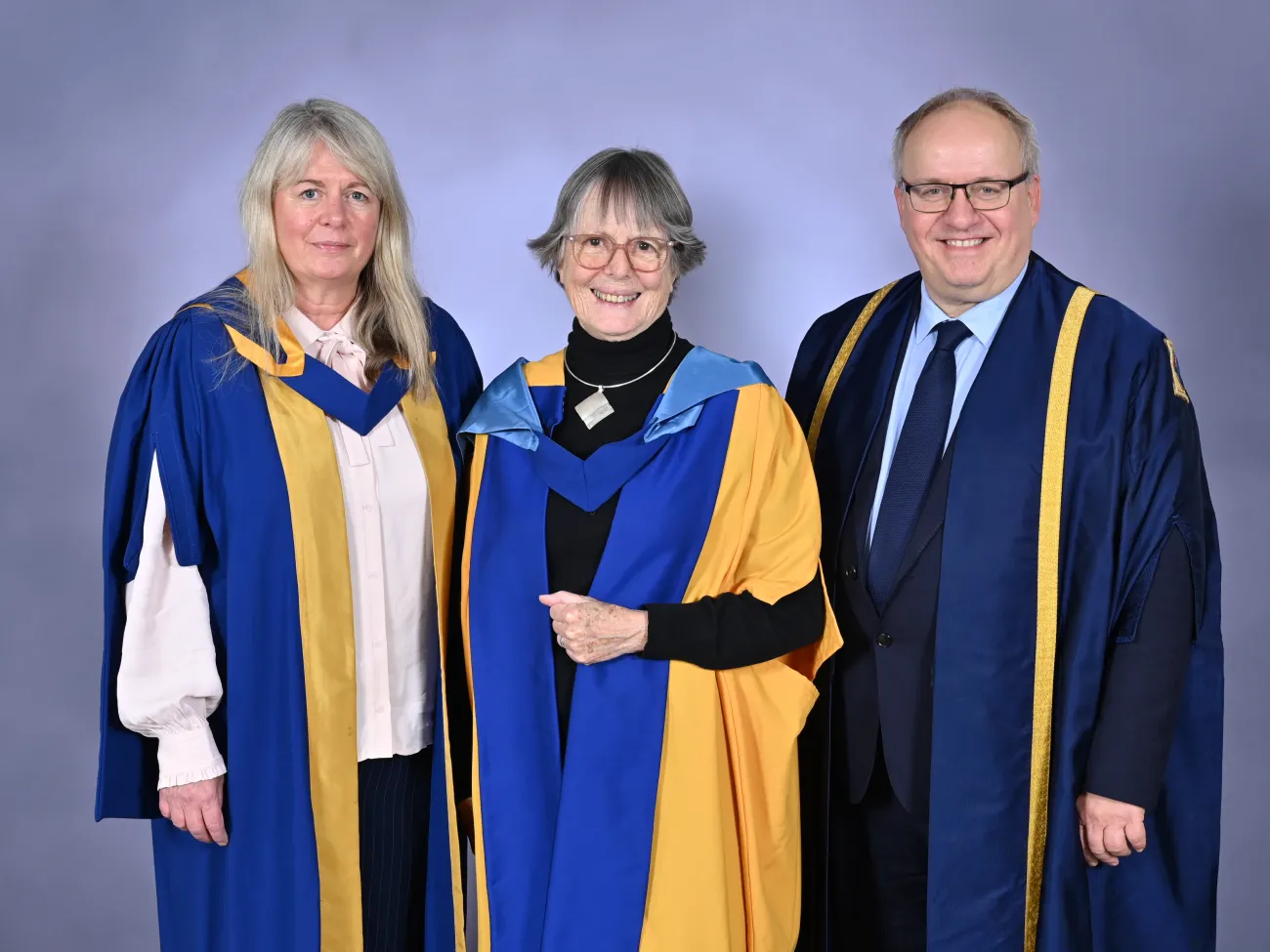 Dr Brenda Boardman standing with the Open University's Dr Rachel Slater and Professor Klaus-Dieter Rossade
