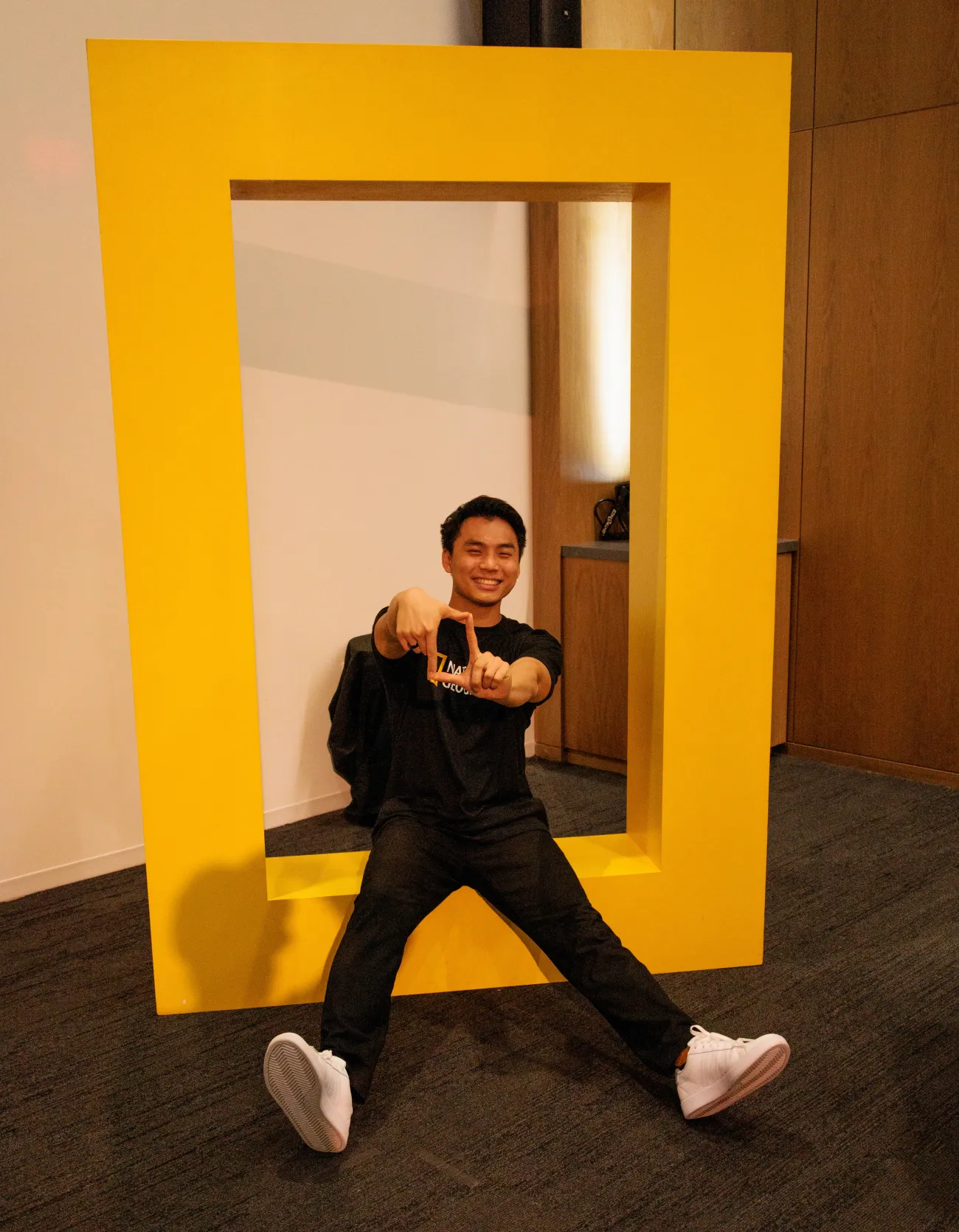 Max Han sat in a 3D logo of National Geographic