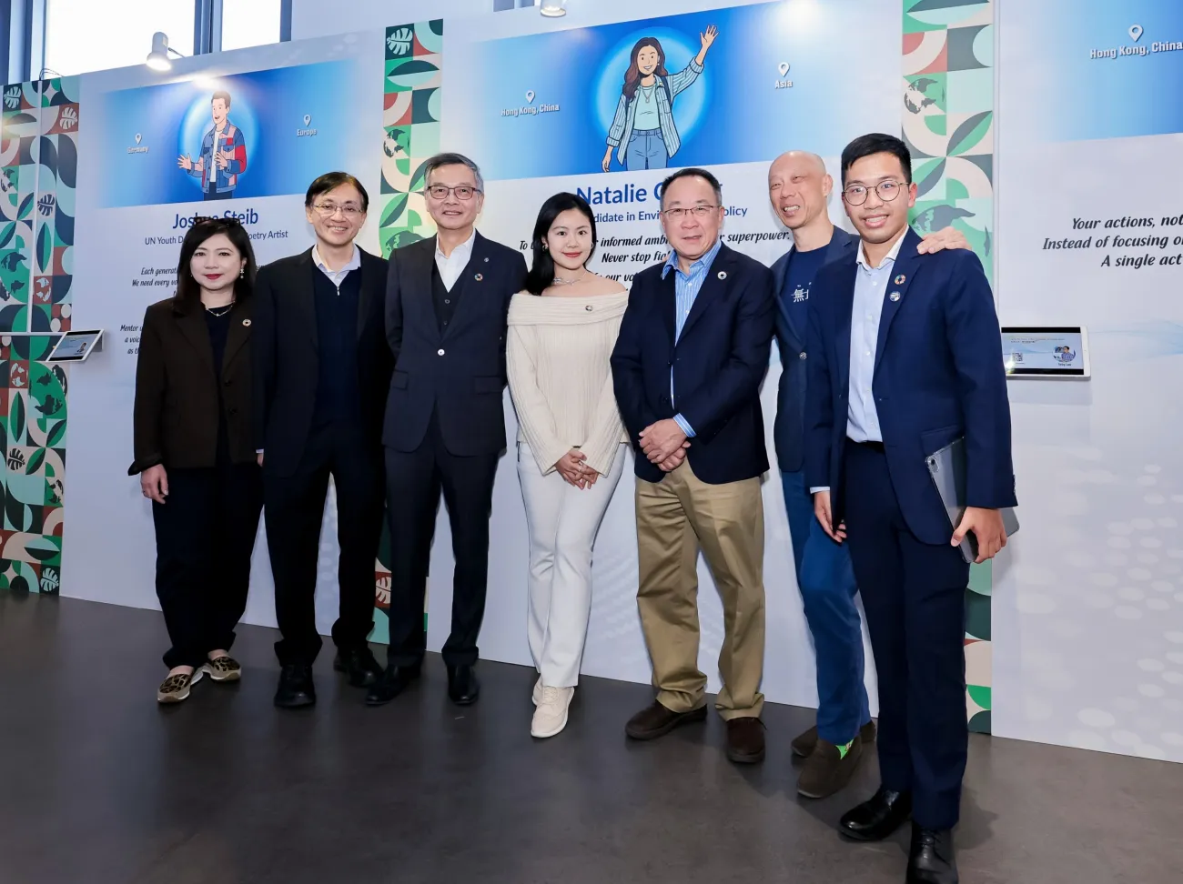 Natalie standing with officiating guests at the exhibition launch