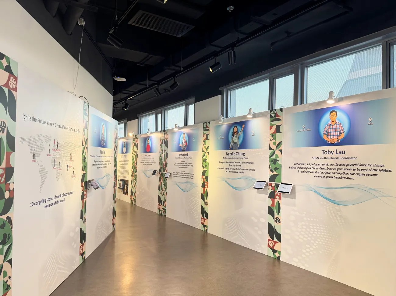 A corridor within the exhibition showing displays on the walls