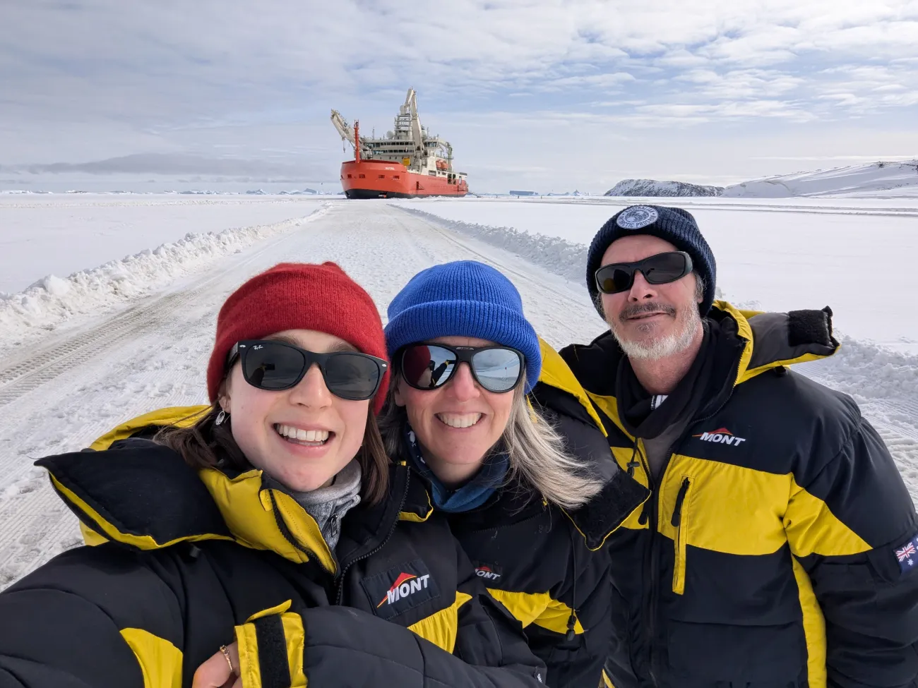 Samantha in a group with deputy voyage leaders with Nuyina in the background