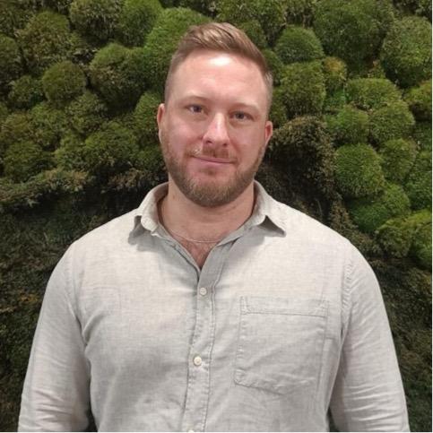 Dr Donal Brown with tree canopy in background