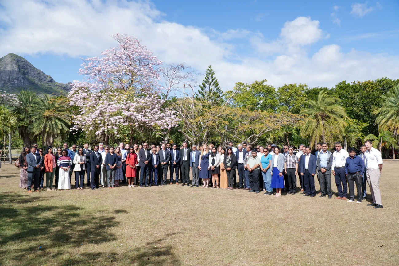 Full group shot of everyone who attended in the garden outside
