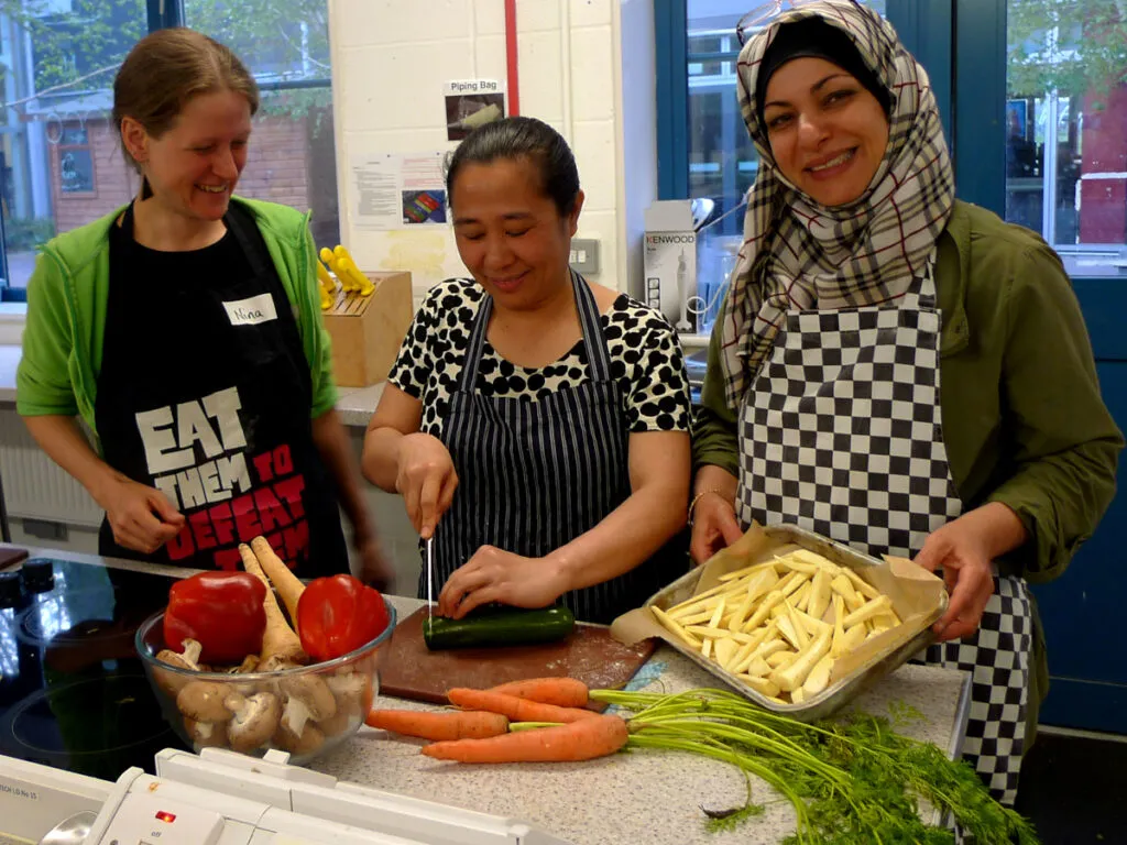 Three women cooking together
