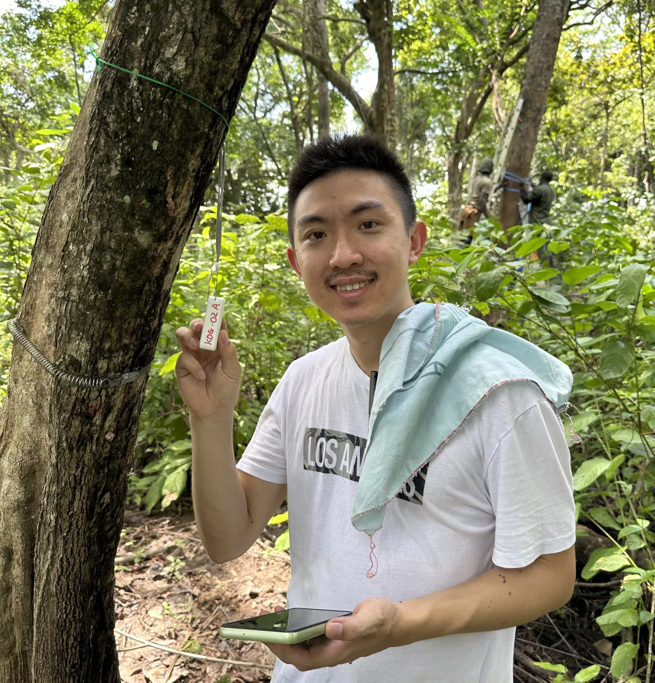 Dr Huanyuan Zhang-Zheng collecting data at a study site