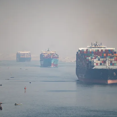 Many cargo ships navigating the Suez Canal, Egypt. 