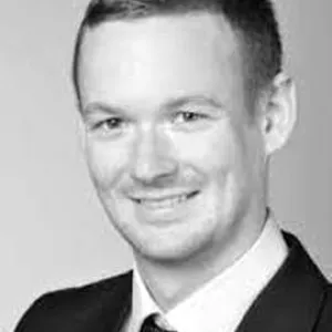 Dr Johannes Bednar head and shoulders image smiling at camera
